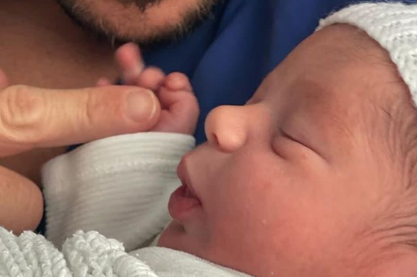 Peter Andre with his newborn daughter