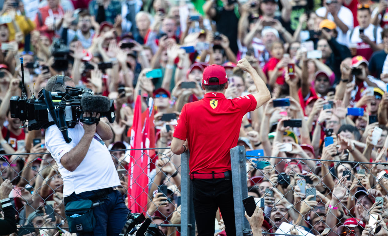 MONZA, ITALY - SEPTEMBER 08: Race winner Charles Leclerc of Monaco and Ferrari celebrates with the fans after the F1 Grand Prix of Italy at Autodromo di Monza on September 08, 2019 in Monza, Italy. (Photo by Lars Baron/Getty Images)