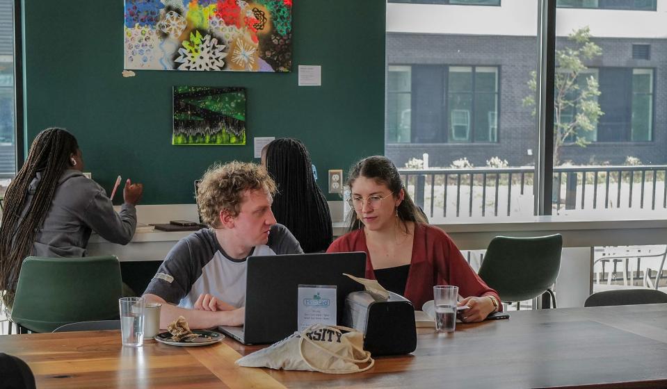 Michigan State graduate students Jack Holligan and Heidi Kroth, live in south Lansing but like to visit Hooked to study and have coffee Saturday, July 22, 2023.