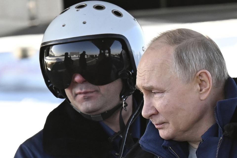 Russian President Vladimir Putin boards a Tu-160M strategic bomber in Kazan, Russia, Thursday, Feb. 22, 2024. (Dmitry Azarov, Sputnik, Kremlin Pool Photo via AP)