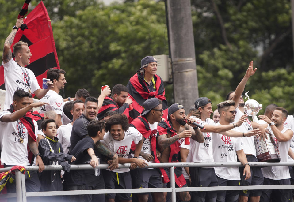 Players of Brazil's Flamengo parade at their arrival in Rio de Janeiro, Brazil, Sunday, Nov. 24, 2019. Flamengo overcame Argentina's River Plate 2-1 in the Copa Libertadores final match on Saturday in Lima to win its second South American title. (AP Photo/Ricardo Borges)