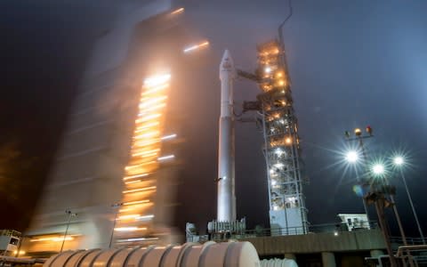 In this May 4, 2018 photo, the mobile service tower is rolled back to reveal the United Launch Alliance Atlas-V rocket with NASA's InSight spacecraft onboard at Vandenberg Air Force Base - Credit: AP