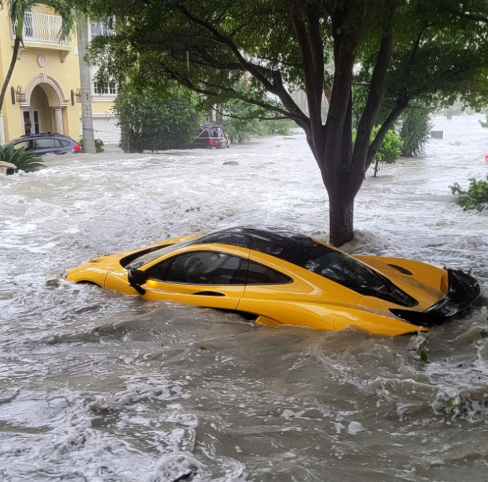A McLaren P1, a hypercar estimated to be worth more than $1m, was swept out of its owner’s garage in Naples and submerged beneath feet of water after Hurricane Ian tore through his neighbourhood (Instagram/@lambo9286)
