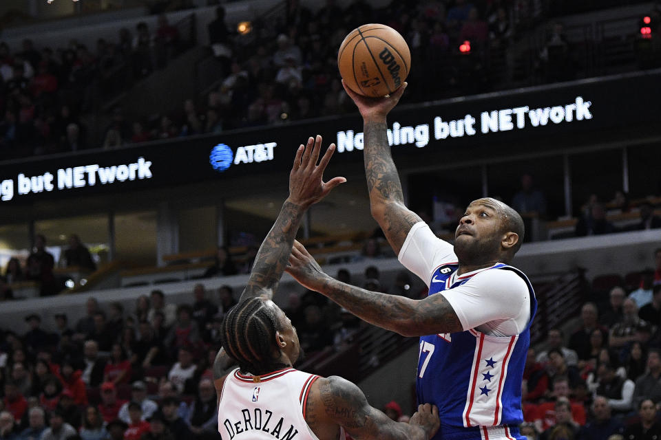 Philadelphia 76ers forward P.J. Tucker (17) shoots against Chicago Bulls forward DeMar DeRozan (11) during the first half of an NBA basketball game Saturday, Oct. 29, 2022, in Chicago. (AP Photo/Matt Marton)