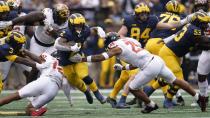 DUPLICATE***Michigan running back Blake Corum (2) makes a move on Maryland defensive back Beau Brade (25) in the first half of an NCAA college football game in Ann Arbor, Mich., Saturday, Sept. 24, 2022. (AP Photo/Paul Sancya)