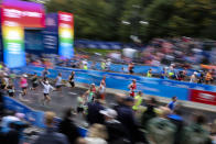 Athletes run at the start of the Berlin Marathon in Berlin, Germany, Sunday, Sept. 25, 2022. (AP Photo/Christoph Soeder)