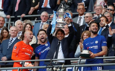 Conte with the trophy - Credit: REUTERS