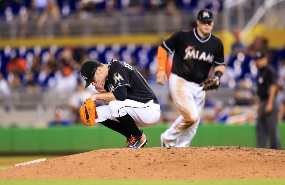 <p>David Phelps of the Miami Marlins pauses on the mound to honor the late Jose Fernandez during the game against the New York Mets at Marlins Park on September 26, 2016 in Miami, Florida. (Photo by Rob Foldy/Getty Images) </p>