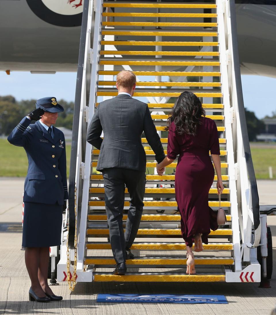 The royal couple hold hands as they depart from Sydney airport.