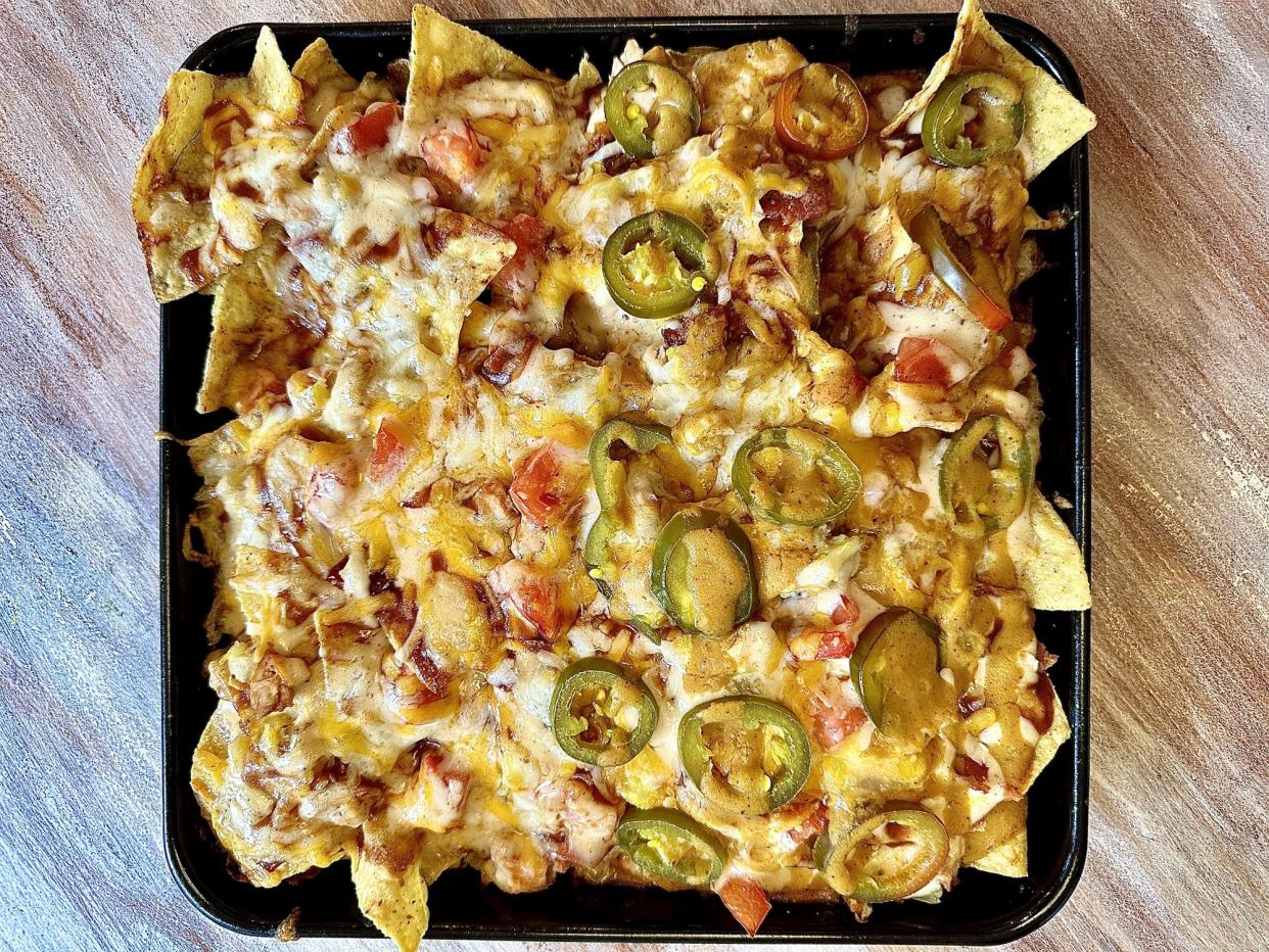 Loaded platter of BBQ chicken nachos.