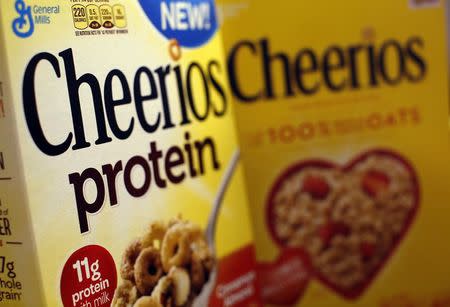 Two types of Cheerios cereal, one with protein (L) and one without, are seen in this photo illustration in Wilmette, Illinois September 12, 2014. REUTERS/Jim Young