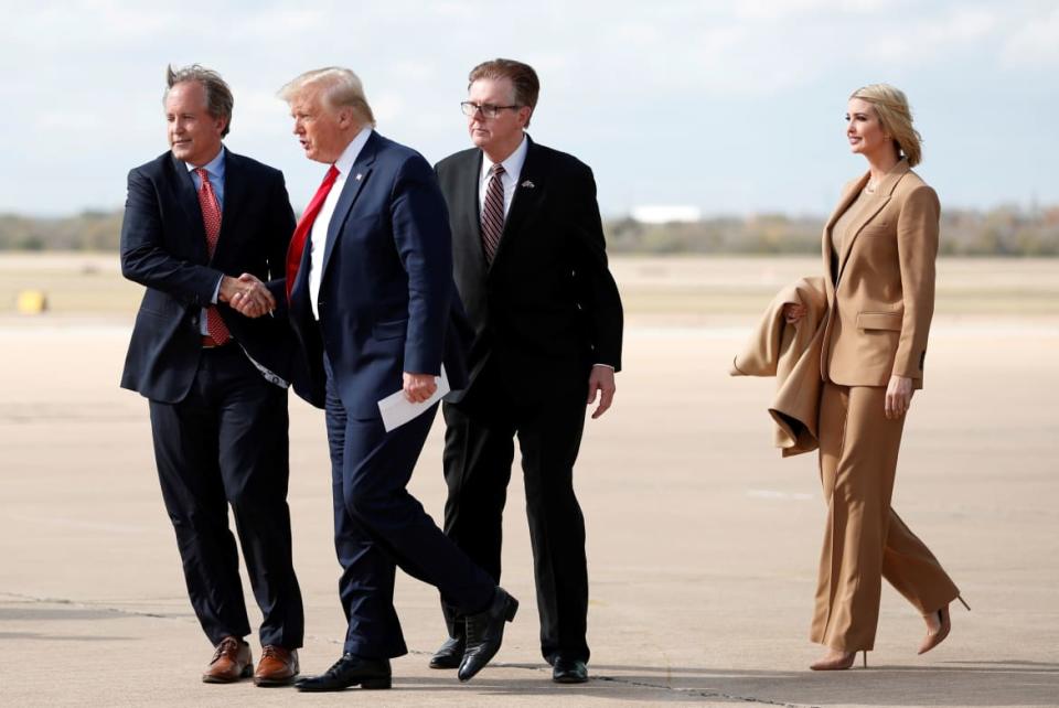 <div class="inline-image__caption"><p>Donald Trump and Ivanka Trump are greeted by Texas Lt. Governor Dan Patrick and Attorney General Ken Paxton as they disembark from Air Force One in Austin, Texas on November 20, 2019.</p></div> <div class="inline-image__credit">Tom Brenner/Reuters</div>