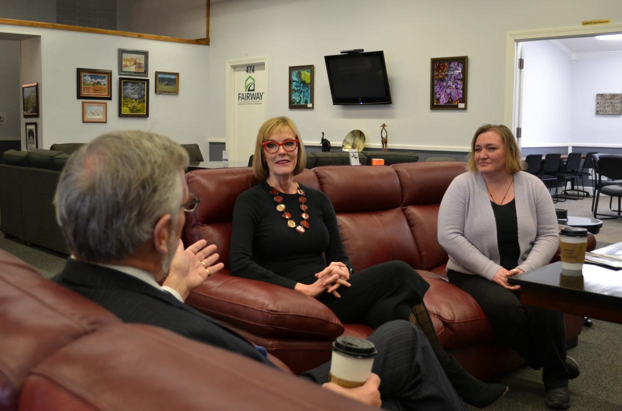 Lt. Gov. Suzanne Crouch, center, and Visit Morgan County Executive Director Tosha Daugherty listen to Martinsville Mayor Kenny Costin discuss economic development opportunities in the city during a discussion Thursday.