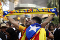 <p>People react as they celebrate the unilateral declaration of independence of Catalonia outside the Catalan Parliament, in Barcelona, Spain, Friday, Oct. 27, 2017. (Photo: Emilio Morenatti/AP) </p>