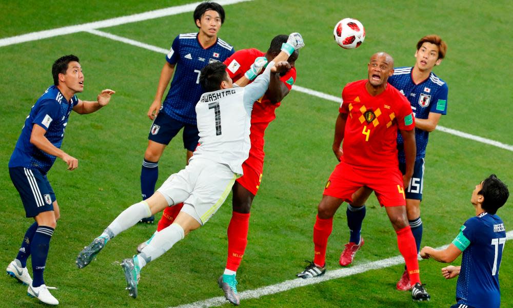 Belgium’s defender Vincent Kompany reacts as Japan’s goalkeeper Eiji Kawashima blocks a header by Belgium’s forward Romelu Lukaku during the Russia 2018 World Cup.