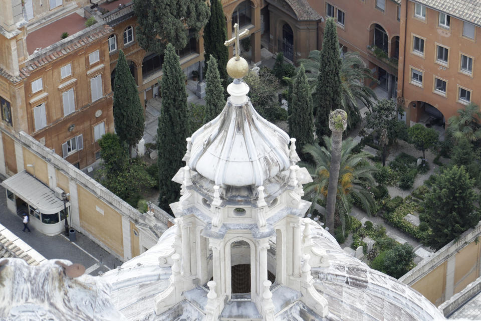 FILE - In this Wednesday, July 10, 2019 file photo, a view of the Teutonic Cemetery inside the Vatican. An expert for the family of a Vatican teenager who went missing in 1983 says there are thousands of bones in an underground space near a Vatican cemetery. Giorgio Portera, engaged by Emanuela Orlandi’s family, said the extent of the cache emerged Saturday when Vatican-appointed experts began cataloguing the remains discovered on July 13. Portera said skulls and bones appear to belong to dozens of individuals. The Vatican made no mention of the number but said analyses would resume on July 27. (AP Photo/Gregorio Borgia, File)