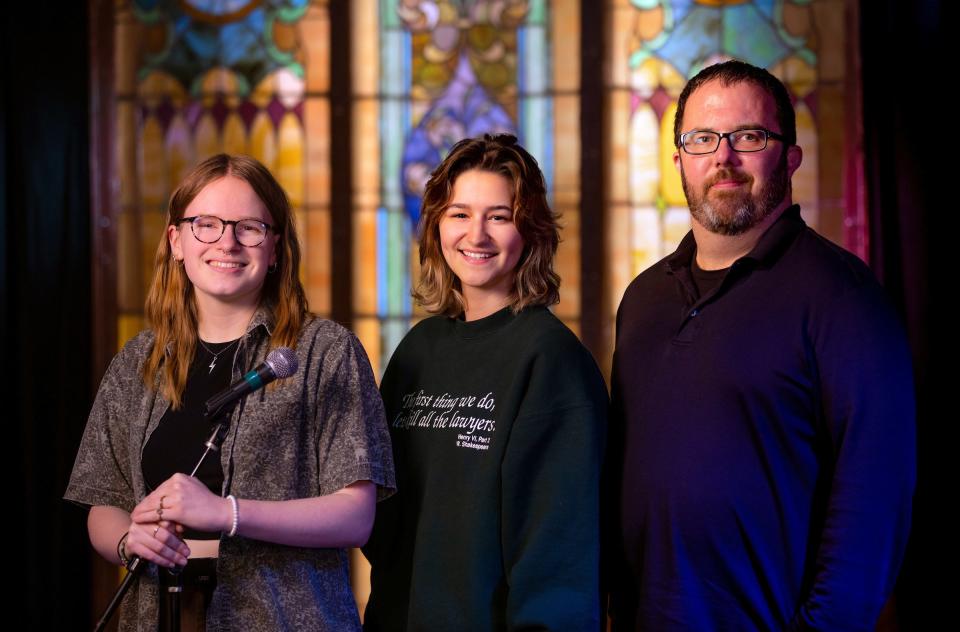 Iowa State University M-Shop directors Allison Talyat, left, and Aryana Bermeo with entertainment programs coordinator and M-Shop manager Jim Brockpahler are seen in front of the venue’s signature stained glass.