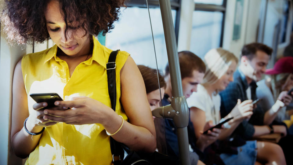 A woman on a train with commuters