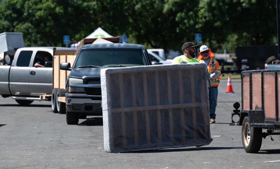 Modesto residents lined up to dispose of household items during a Modesto city sponsored trash day at John Thurman Field in Modesto, Calif., on Saturday, June, 25, 2022.