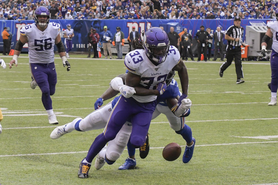 Minnesota Vikings running back Dalvin Cook is stripped of the ball for a fumble by New York Giants free safety Jabrill Peppers (21) during the second quarter of an NFL football game, Sunday, Oct. 6, 2019, in East Rutherford, N.J. (AP Photo/Bill Kostroun)