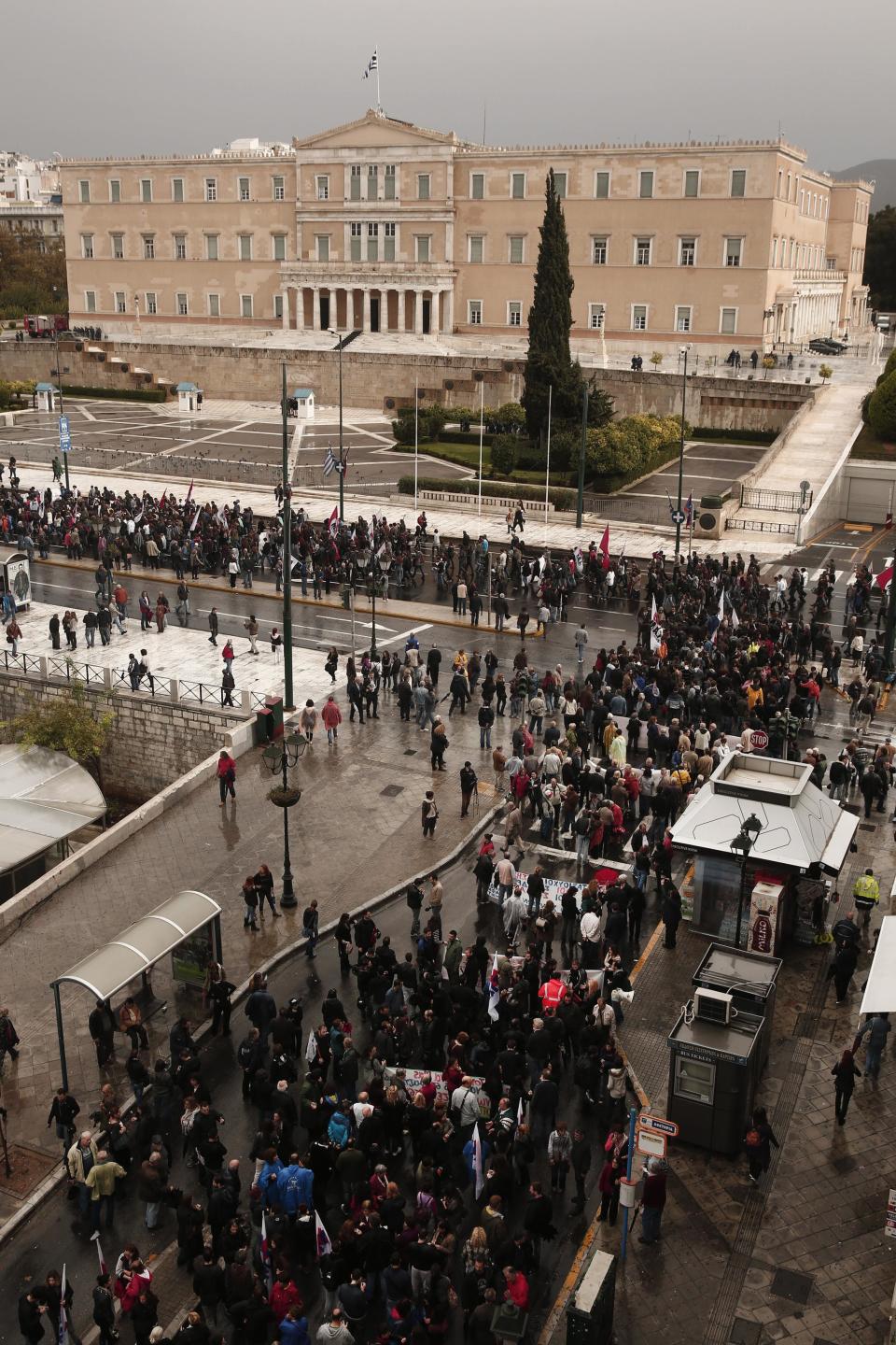 Protesters march during a 24-hour general labour strike in front of the parliament in Athens