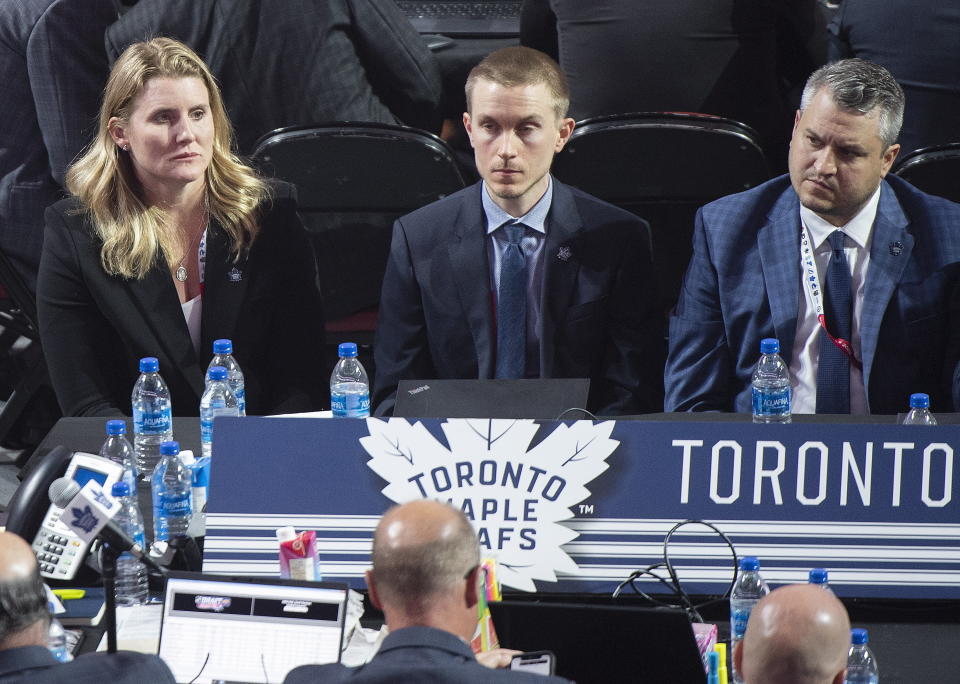 FILE - Toronto Maple Leafs hockey team assistant general manager Hayley Wickenheiser, left, takes part in the first round of the NHL draft in Montreal, Thursday, July 7, 2022. Wickenheiser is one of five women currently serving as assistant GMs in the NHL. (Graham Hughes/The Canadian Press via AP, File)