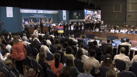 A group of Venezuelan opposition lawmakers and members of the Venezuela diaspora protest at the Organization of American States (OAS) 47th General Assembly in Cancun, Mexico June 21, 2017 in this still image taken from video. OAS POOL TV via REUTERS
