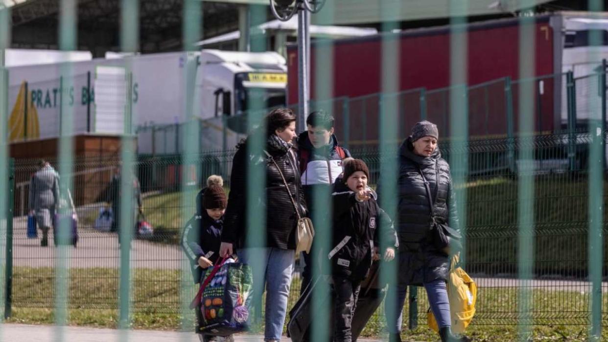 Refugees from Ukraine are seen as they cross the Ukrainian-Polish border at the border crossing in Medyka, southeastern Poland on April 8, 2022. - The flow of people escaping Russia's war in Ukraine has slowed but those now fleeing have often spent weeks in dire conditions, the United Nations said on April 8. UNHCR, the UN refugee agency, said 4,382,316 Ukrainians had fled the country since the war began on February 24. (Photo by Wojtek RADWANSKI / AFP) (Photo by WOJTEK RADWANSKI/AFP via Getty Images)