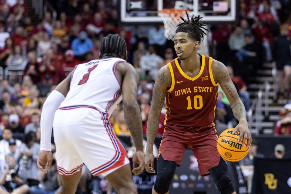 Iowa State guard Keshon Gilbert drives around Houston guard Ramon Walker Jr. during the Big 12 Tournament championship game on Saturday.