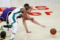 Los Angeles Lakers' Marc Gasol, back, and Boston Celtics' Kemba Walker chase the ball during the second half of an NBA basketball game Thursday, April 15, 2021, in Los Angeles. (AP Photo/Ringo H.W. Chiu)