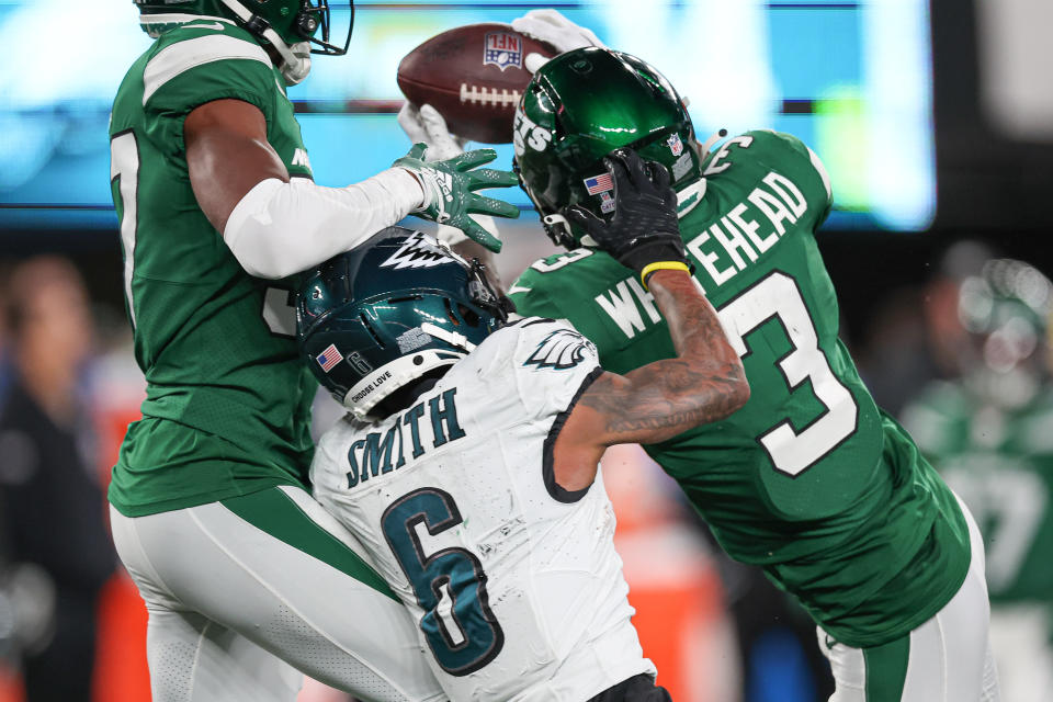 Oct 15, 2023; East Rutherford, New Jersey, USA; New York Jets safety Jordan Whitehead (3) breaks up a pass intended for Philadelphia Eagles wide receiver DeVonta Smith (6) in front of cornerback Bryce Hall (37) during the second half at MetLife Stadium. Mandatory Credit: Vincent Carchietta-USA TODAY Sports