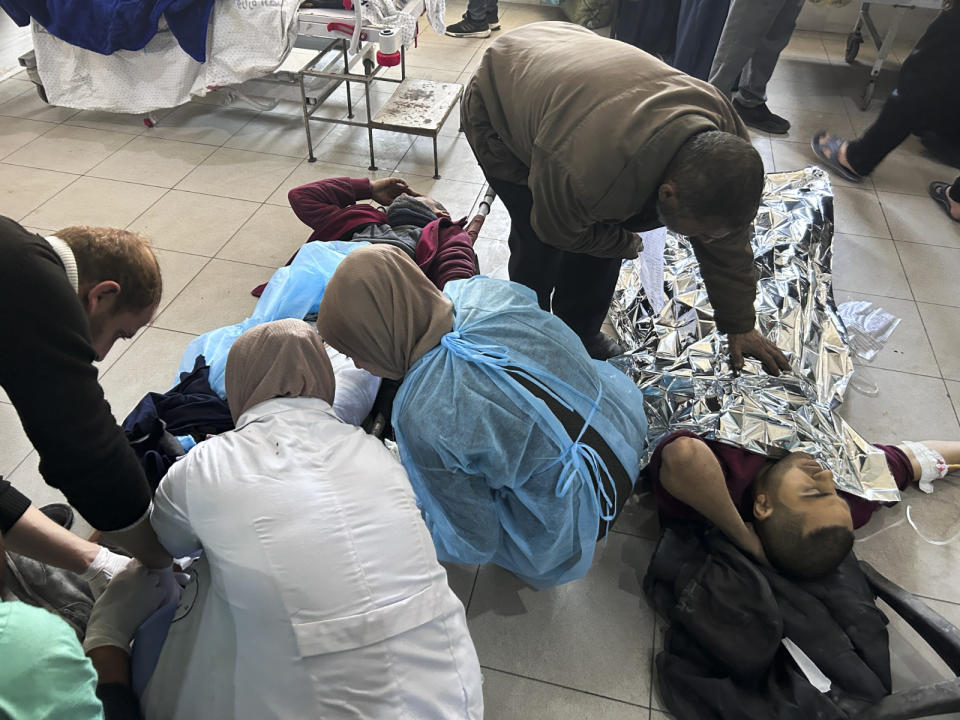 Palestinians wounded in an Israeli strike while waiting for humanitarian aid on the beach in Gaza City are treated in Shifa Hospital on Thursday, Feb. 29, 2024. (AP Photo/Mahmoud Essa)