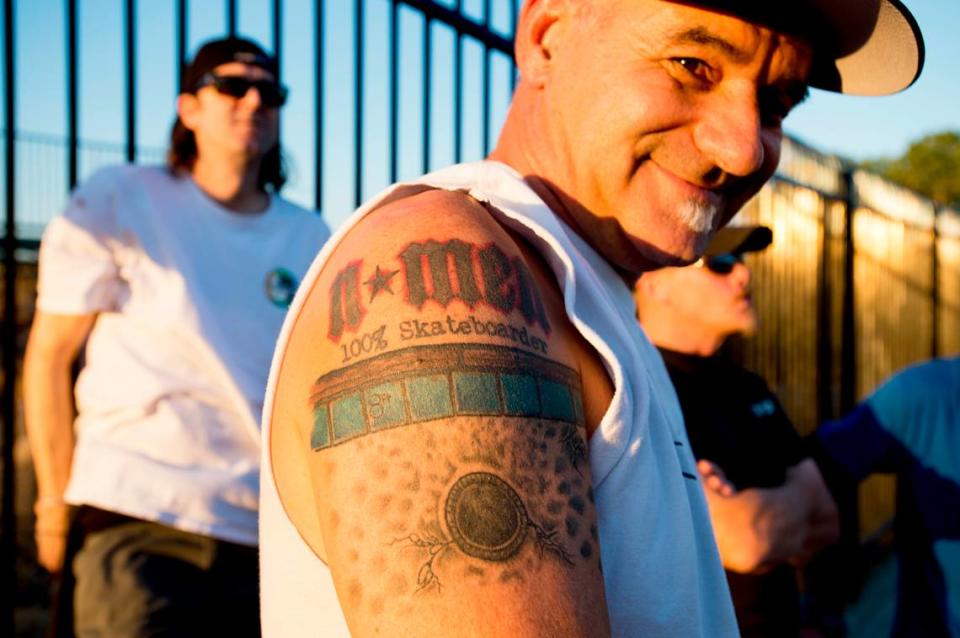 N-Men member Randy Katen shows his N-Men tattoo in 2013.