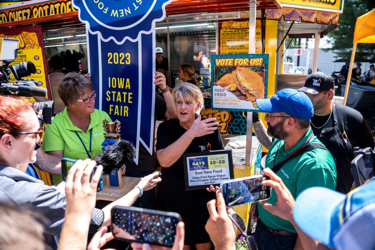 Joni Bell of What's Your Cheez speaks with reporters after winning 2023 Best New Food for the deep-fried bacon brisket mac-n-cheese.