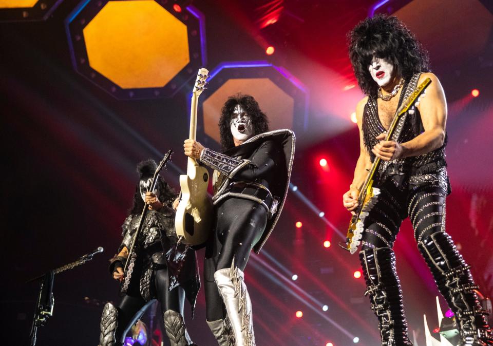 KISS bass guitarist Gene Simmons, guitarist Tommy Thayer and vocalist and guitarist Paul Stanley take center stage during their show at Acrisure Arena in Palm Desert, Calif., Wednesday, Nov. 1, 2023.