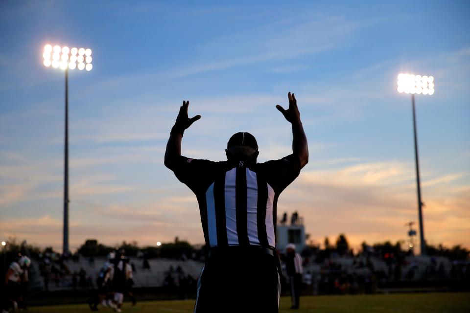 A referee signals after an extra point during a high school football game between Star Spencer and Jones in Spencer on Sept. 23, 2021.