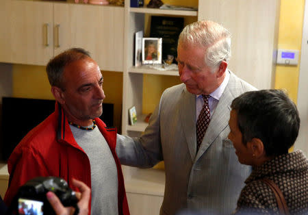 Britain's Prince Charles meet residents as he visit to the town of Amatrice, which was levelled after an earthquake last year, in central Italy April 2, 2017. REUTERS/Alessandro Bianchi
