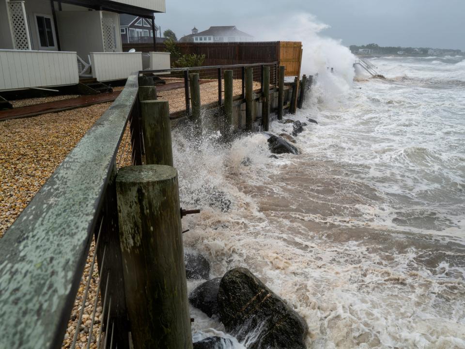 Waves pound a seawall in Montauk, N.Y., Sunday, Aug. 22, 2021, as Tropical Storm Henri affects the Atlantic coast.