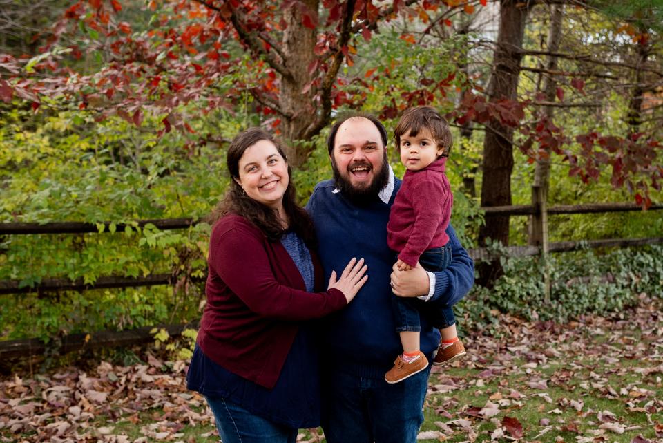 Shannon Rae Green with her husband and son in her backyard.