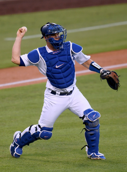 LOS ANGELES, CALIFORNIA - AUGUST 12: Will Smith #16 of the Los Angeles Dodgers makes a throw.