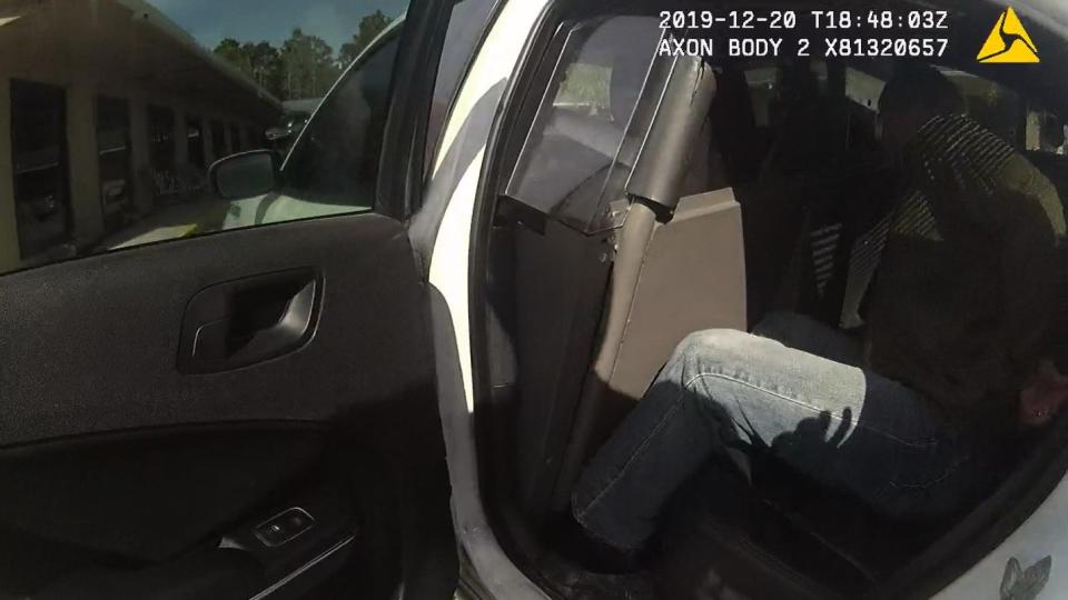 FBI Special Agent Alexis Hatten was handcuffed and placed in the back of a Franklin County Sheriff's Office patrol car Dec. 20 in Carrabelle.