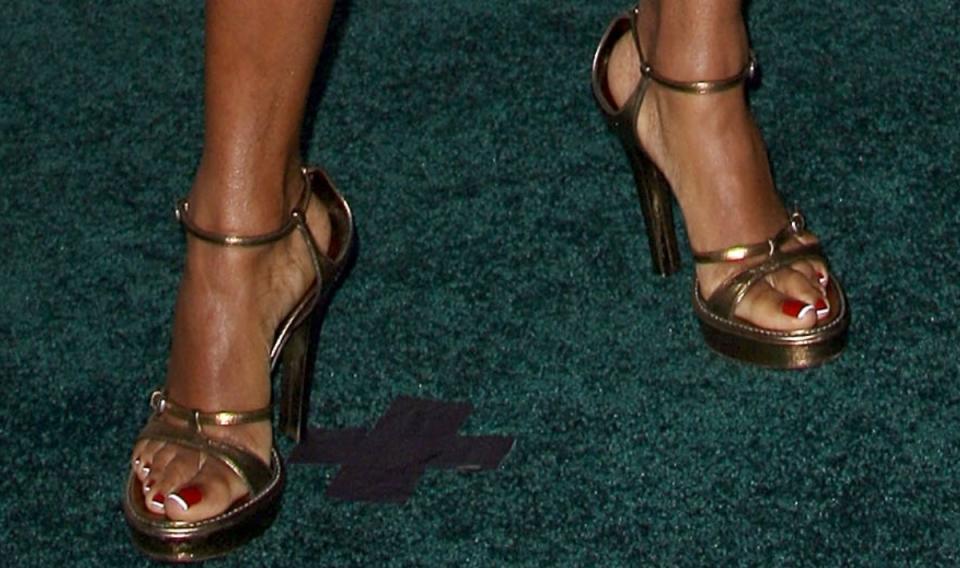 regina king, regina king shoe style, shoes, gold sandals, gold platform sandals, strappy gold sandals