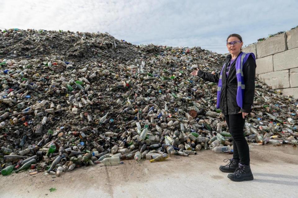 Director of sustainability and strategic analysis Lydia Gibson gives a tour of the Ripple Glass processing facility on Wednesday, March 15, 2023, in Kansas City.