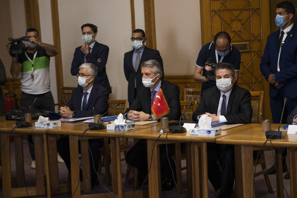 Turkish Foreign Ministry Deputy Sedat Onal, seated right, meets with Hamdi Sanad Loza, Egyptian deputy foreign minister along with their delegations, at the foreign ministry in Cairo, Egypt, Wednesday, May 5, 2021. (AP Photo/Nariman El-Mofty)