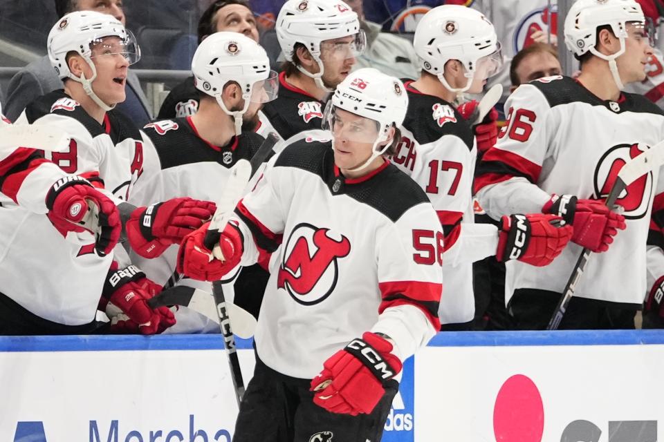 New Jersey Devils' Erik Haula (56) celebrates with teammates after scoring a goal during the second period of an NHL hockey game against the New York Islanders Monday, March 27, 2023, in Elmont, N.Y. (AP Photo/Frank Franklin II)