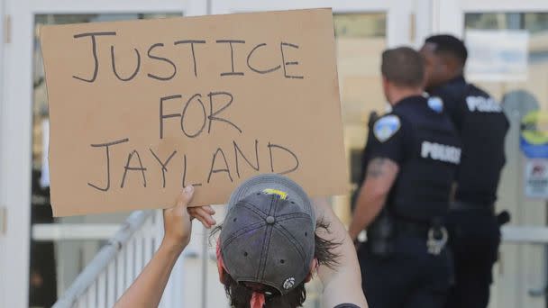 PHOTO: Akron Police Officers are confronted by protesters as they enter the Stubbs Justice Center during a protest over the Akron police shooting death of Jayland Walker, June 30, 2022 in Akron, Ohio. (Phil Masturzo/ USA TODAY NETWORK)