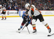 Anaheim Ducks left wing Rickard Rakell (67) attempts to gain control of the puck Colorado Avalanche center Tyson Jost (17) moves in during the second period in an NHL hockey game Wednesday, March 4, 2020 in Denver. (AP Photo/John Leyba)