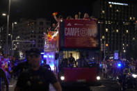 Spain's Women's World Cup soccer team celebrate on top of bus as they arrive in Madrid, Spain, Monday, Aug. 21, 2023. Spain beat England in Sydney Sunday to win the Women's World Cup soccer final. (AP Photo/Manu Fernandez)