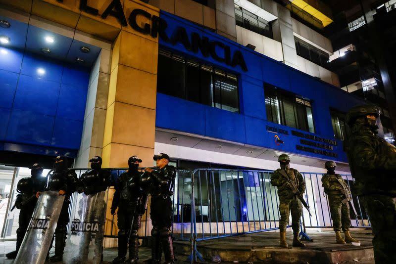 FILE PHOTO: Police and military officials stand outside the Flagrancy Unit, where former Ecuador Vice President Jorge Glas is believed to be detained, in Quito