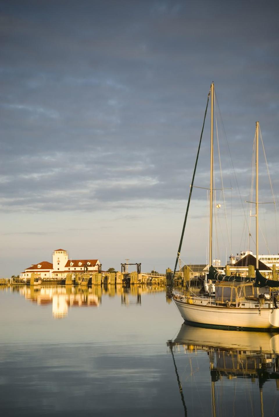 <p>This slim island in North Carolina's Outer Banks is home to just under 1,000 people. Only accessible by boat or plane, much of the island is the undeveloped <a href="https://www.outerbanks.com/cape-hatteras-national-seashore.html" rel="nofollow noopener" target="_blank" data-ylk="slk:Cape Hatteras National Seashore;elm:context_link;itc:0;sec:content-canvas" class="link ">Cape Hatteras National Seashore</a>, where you can find <a href="https://www.outerbanks.com/ocracoke.html" rel="nofollow noopener" target="_blank" data-ylk="slk:wild ponies;elm:context_link;itc:0;sec:content-canvas" class="link ">wild ponies</a> (believed to be descendants of Spanish Mustangs) roaming. You can explore the island on foot, bike, or horseback, then head back to the village for a meal at a laid-back waterfront restaurant. Since the population is so small, it's kind of like Cheers: Everyone knows your name.</p>